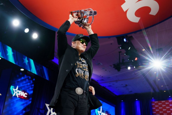 Amid raucous support, Musk appears at CPAC rally with chainsaw