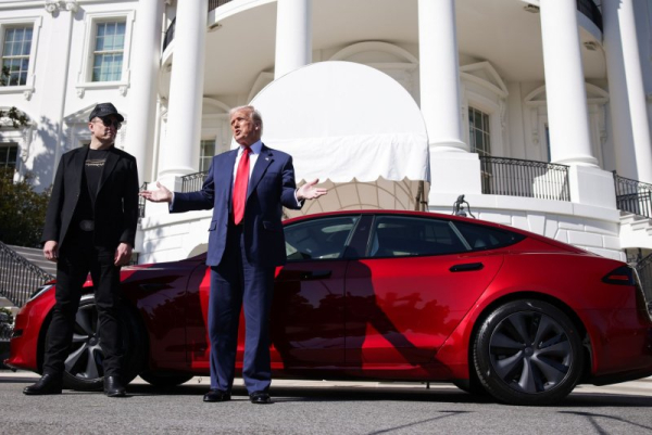 At White House, Trump says he will buy Tesla in show of support for Elon Musk