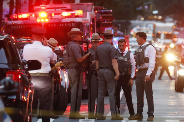 Four dead, including NYPD officer, in Manhattan skyscraper shooting