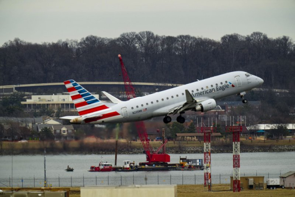 Passengers evacuate a flight after landing gear malfunction