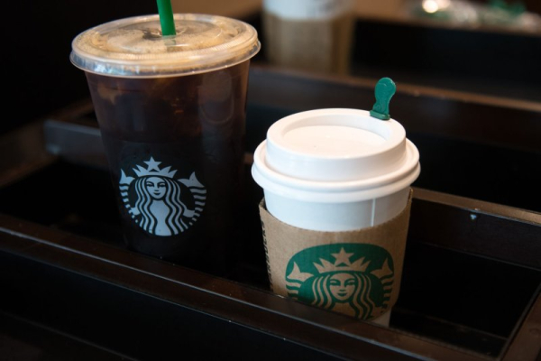 Starbucks to close hundreds of stores, lay off 900 corporate workers