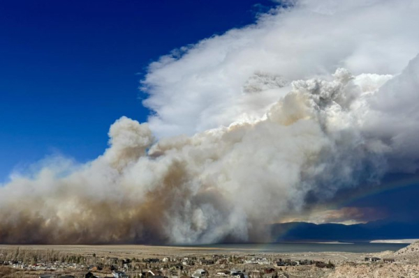 Storm whips up Central California wildfire, helps bring relief